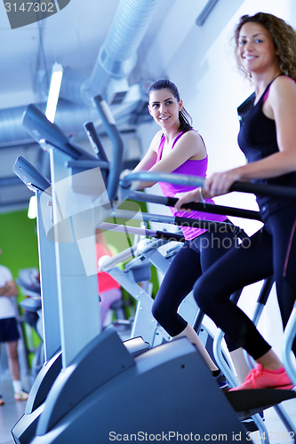 Image of Group of people running on treadmills