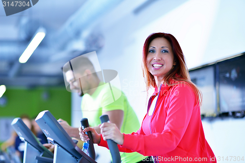 Image of Group of people running on treadmills