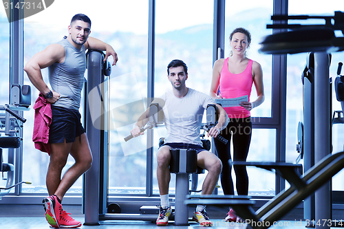 Image of woman exercising with her personal trainer