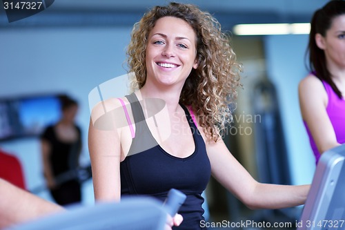 Image of Group of people running on treadmills