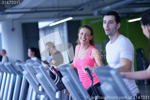 Image of Group of people running on treadmills