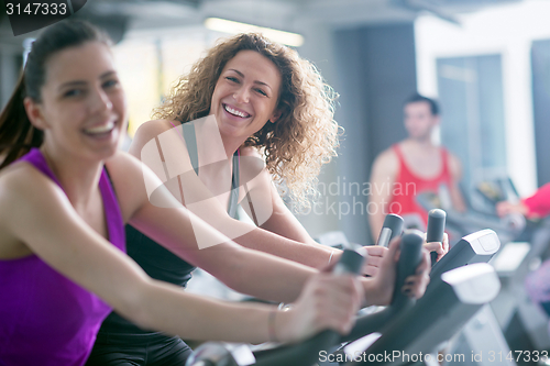 Image of Group of people running on treadmills