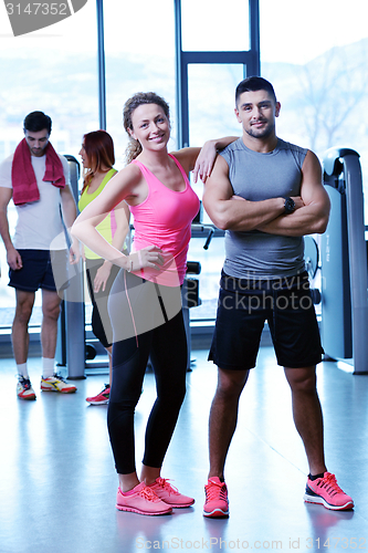 Image of Group of people exercising at the gym