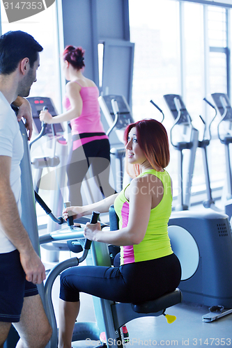 Image of woman exercising with her personal trainer