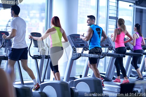 Image of Group of people running on treadmills