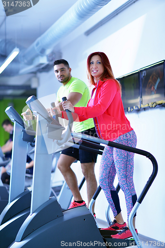 Image of Group of people running on treadmills