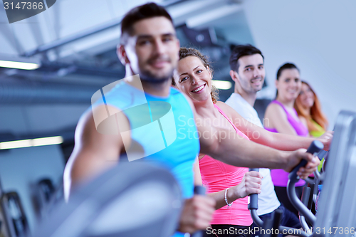 Image of Group of people running on treadmills