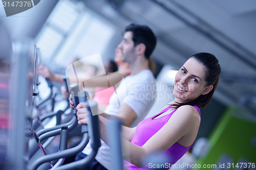 Image of Group of people running on treadmills