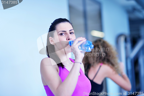 Image of Group of people running on treadmills