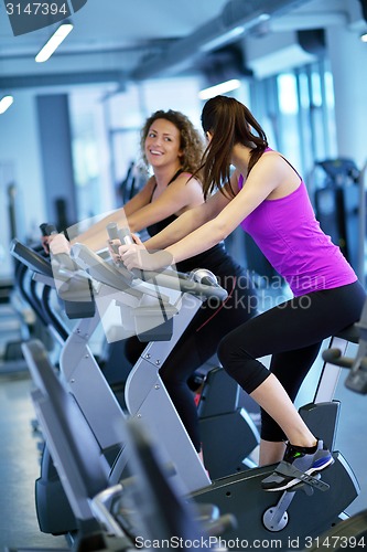 Image of Group of people running on treadmills