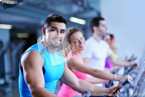 Image of Group of people running on treadmills