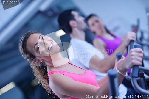 Image of Group of people running on treadmills