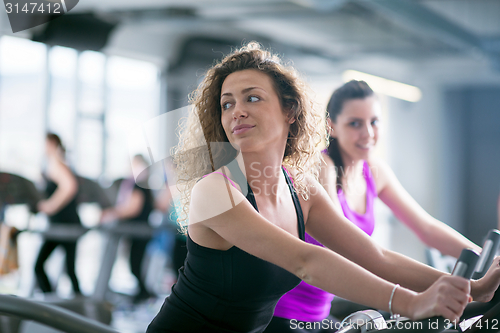 Image of Group of people running on treadmills