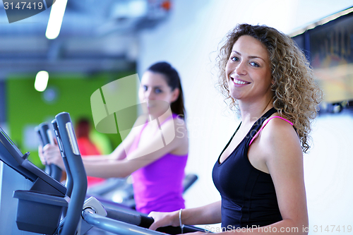 Image of Group of people running on treadmills