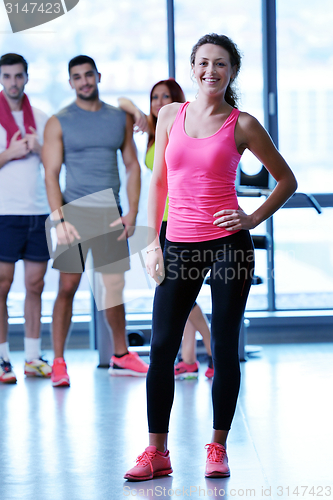 Image of Group of people exercising at the gym