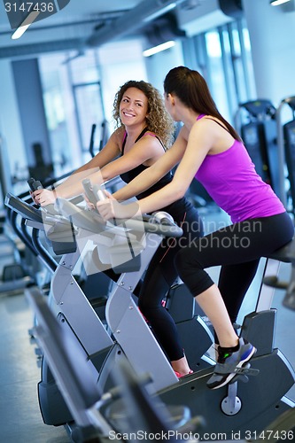 Image of Group of people running on treadmills