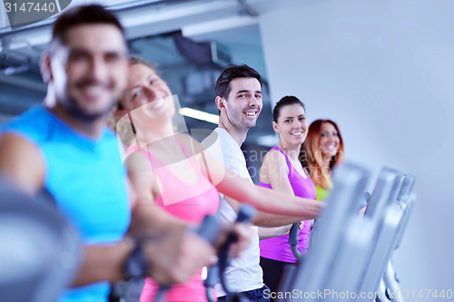 Image of Group of people running on treadmills