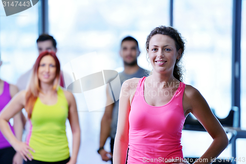 Image of Group of people exercising at the gym