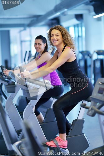 Image of Group of people running on treadmills