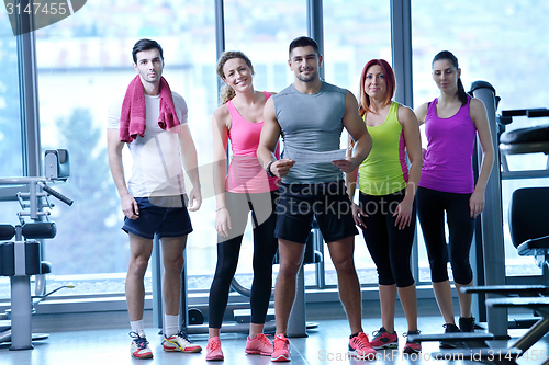 Image of Group of people exercising at the gym