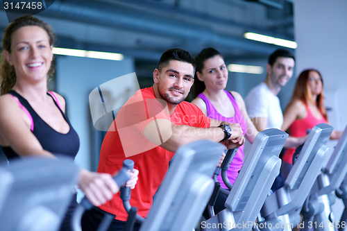 Image of Group of people running on treadmills