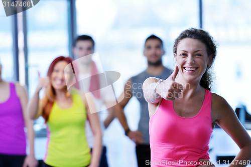 Image of Group of people exercising at the gym