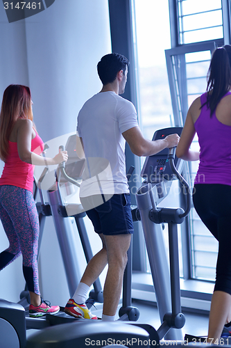 Image of woman exercising on treadmill in gym