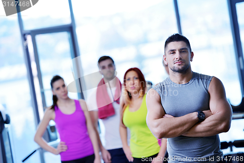 Image of Group of people exercising at the gym