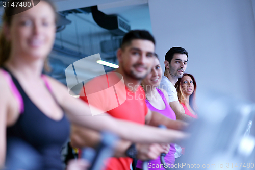 Image of Group of people running on treadmills