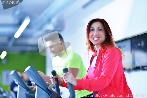 Image of Group of people running on treadmills