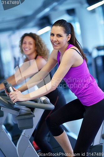 Image of Group of people running on treadmills
