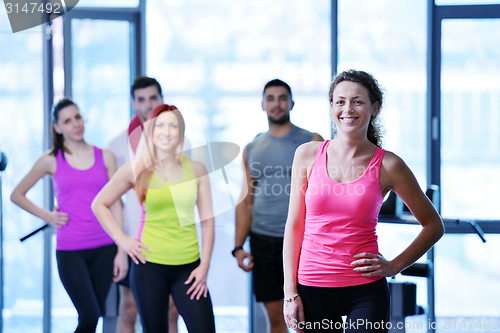 Image of Group of people exercising at the gym