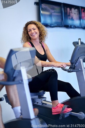 Image of woman exercising on treadmill in gym