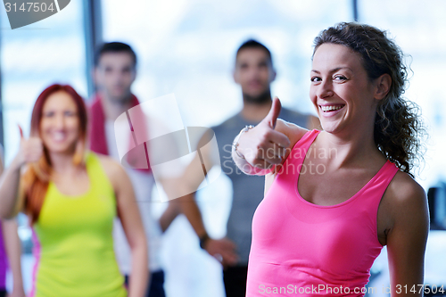 Image of Group of people exercising at the gym