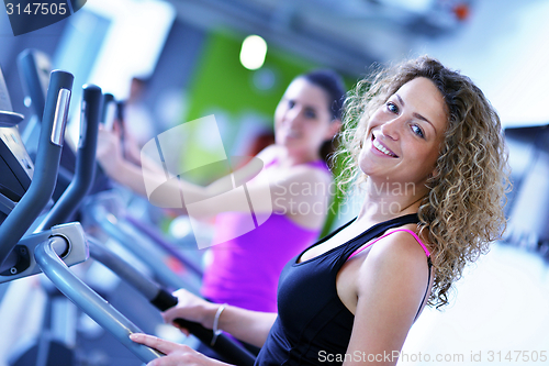 Image of Group of people running on treadmills