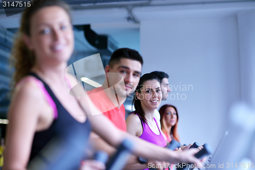 Image of Group of people running on treadmills