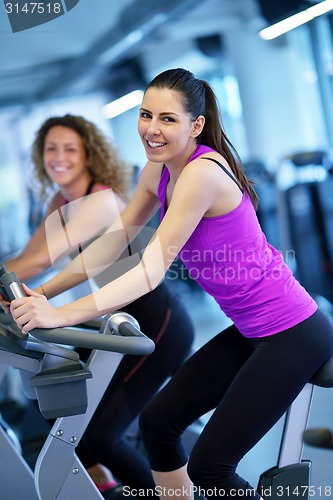 Image of Group of people running on treadmills