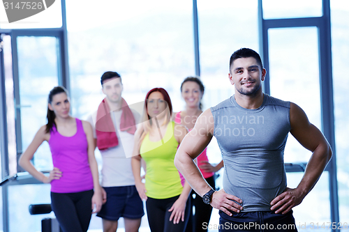 Image of Group of people exercising at the gym