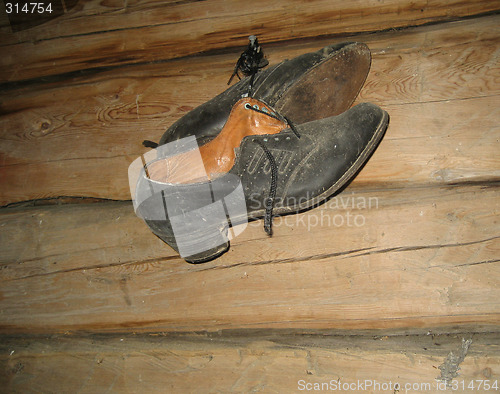 Image of Shoes on old wall