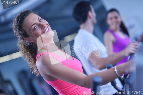 Image of Group of people running on treadmills