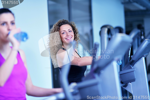 Image of Group of people running on treadmills