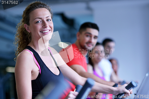 Image of Group of people running on treadmills