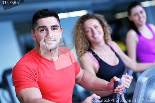 Image of Group of people running on treadmills