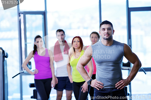 Image of Group of people exercising at the gym