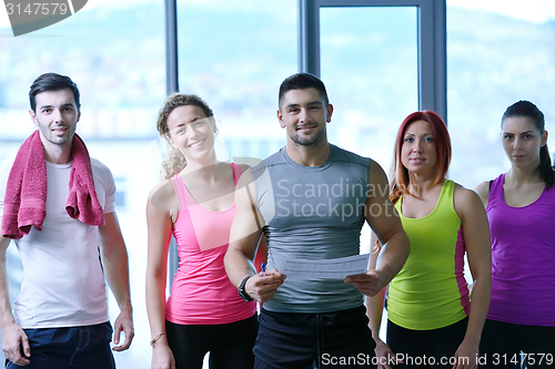 Image of Group of people exercising at the gym