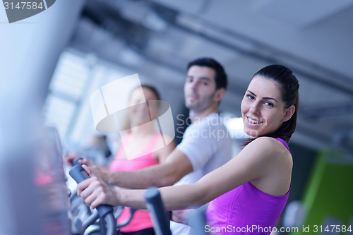 Image of Group of people running on treadmills