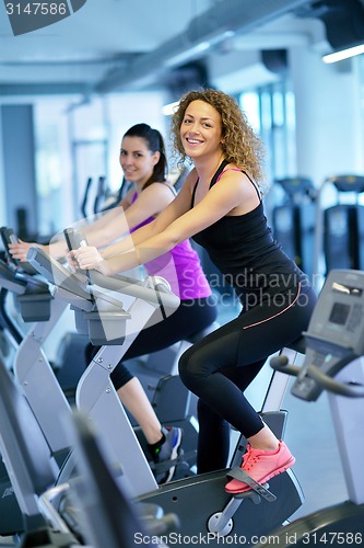 Image of Group of people running on treadmills