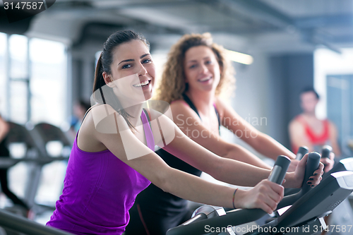 Image of Group of people running on treadmills