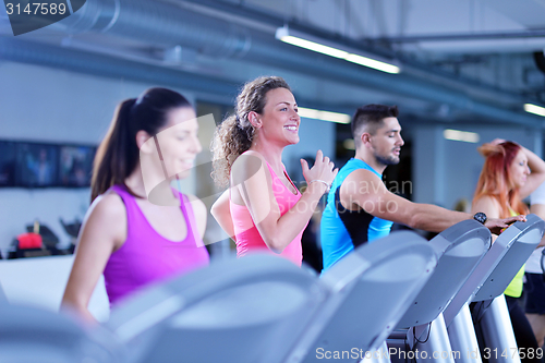 Image of Group of people running on treadmills