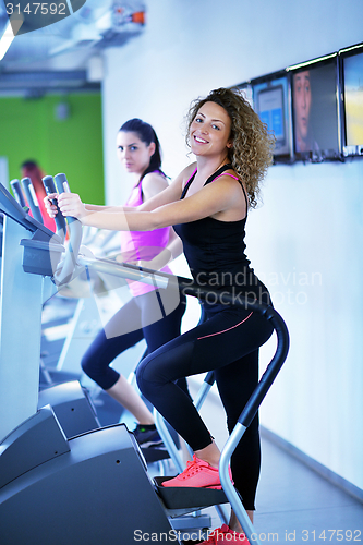 Image of Group of people running on treadmills